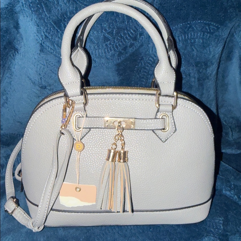 Brand new gray purse that can be a crossbody or handles
